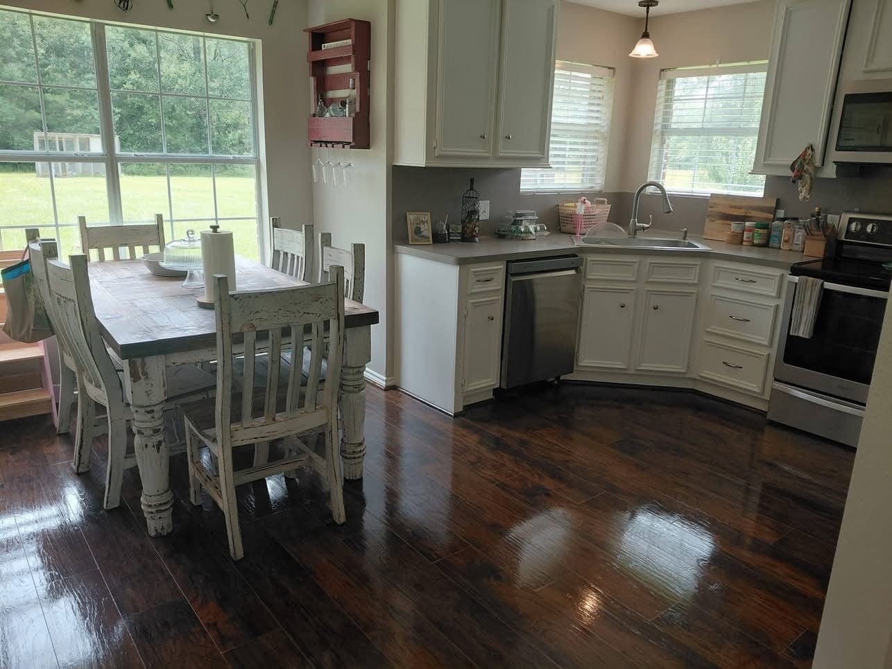 The same kitchen after cleaning, with a shiny wood floor